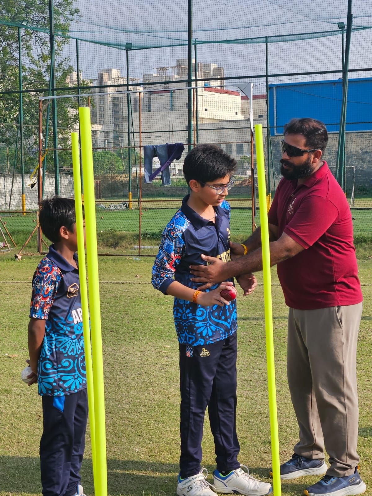 Entrance arch reading Welcome to Aradhya Cricket Club